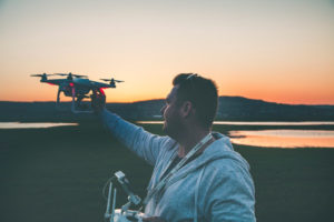 man launching drone