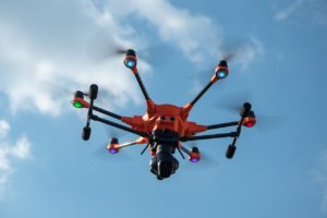 orange drone in air